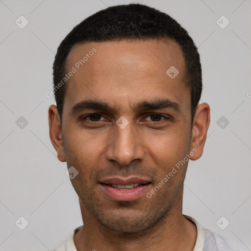 Joyful white young-adult male with short  black hair and brown eyes