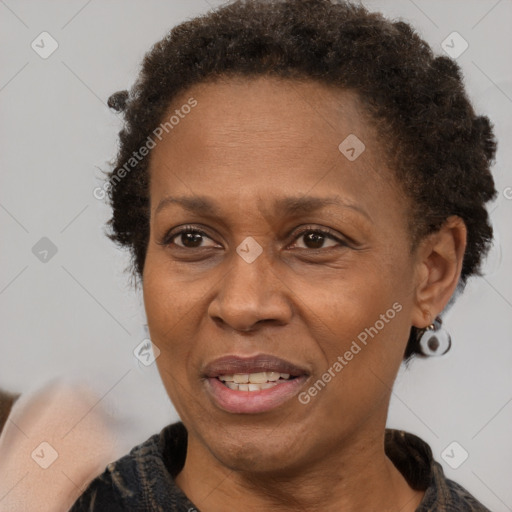 Joyful black adult female with short  brown hair and brown eyes