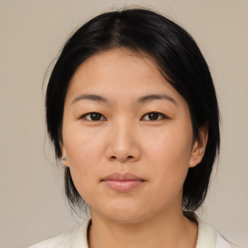 Neutral asian young-adult female with medium  black hair and brown eyes