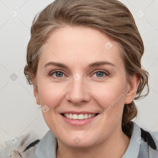 Joyful white young-adult female with medium  brown hair and blue eyes