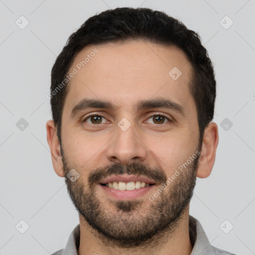 Joyful white young-adult male with short  black hair and brown eyes