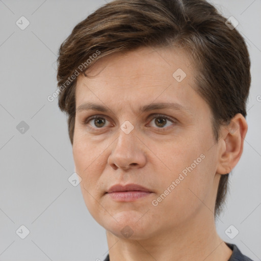 Joyful white adult female with short  brown hair and brown eyes