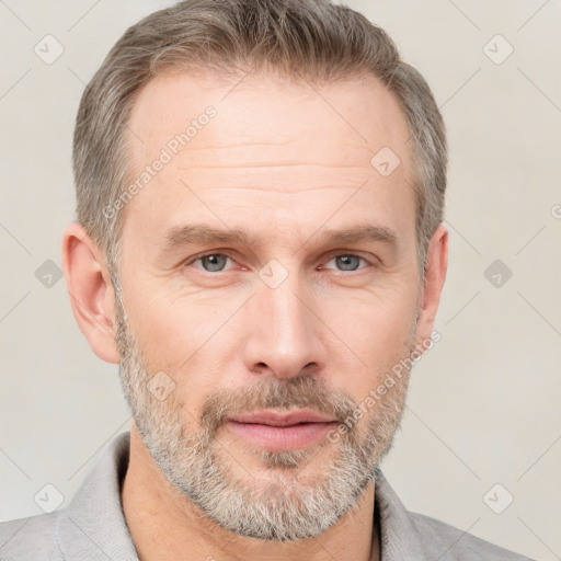 Neutral white adult male with short  brown hair and grey eyes