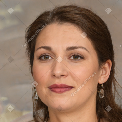 Joyful white adult female with medium  brown hair and brown eyes