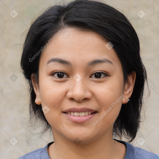 Joyful asian young-adult female with medium  black hair and brown eyes