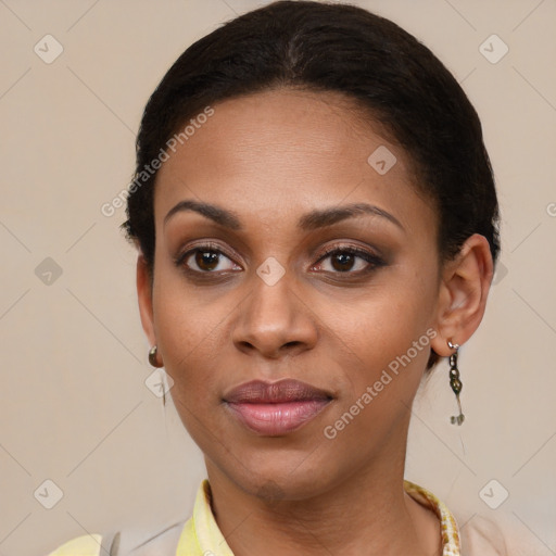 Joyful black young-adult female with medium  brown hair and brown eyes