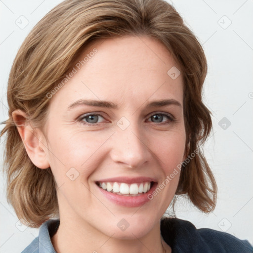 Joyful white young-adult female with medium  brown hair and blue eyes