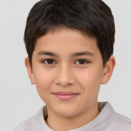 Joyful white child male with short  brown hair and brown eyes