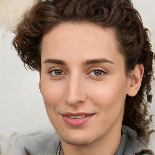 Joyful white young-adult female with medium  brown hair and green eyes