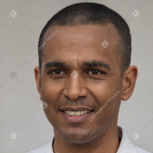 Joyful black adult male with short  black hair and brown eyes