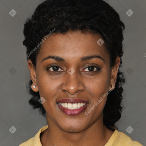 Joyful black young-adult female with short  black hair and brown eyes