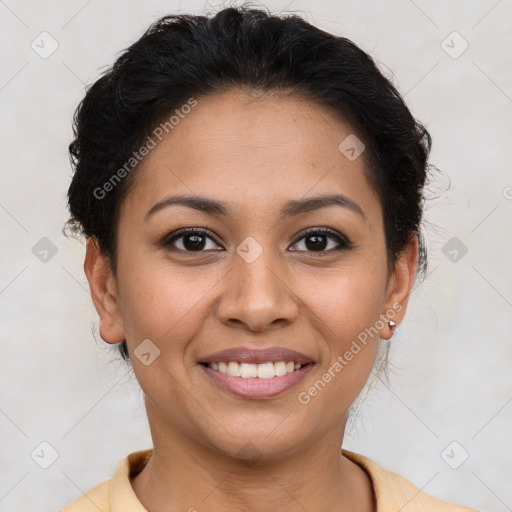 Joyful latino young-adult female with short  brown hair and brown eyes