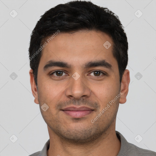 Joyful latino young-adult male with short  black hair and brown eyes