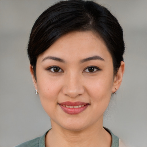Joyful white young-adult female with medium  brown hair and brown eyes