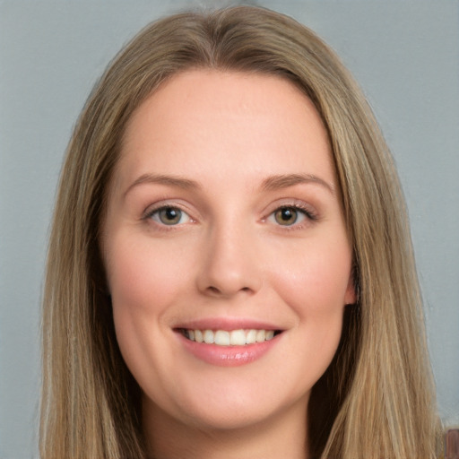 Joyful white young-adult female with long  brown hair and grey eyes