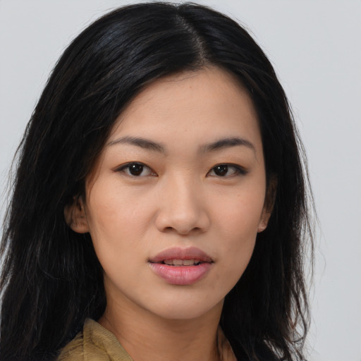 Joyful white young-adult female with long  black hair and brown eyes