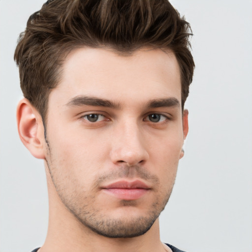 Neutral white young-adult male with short  brown hair and brown eyes