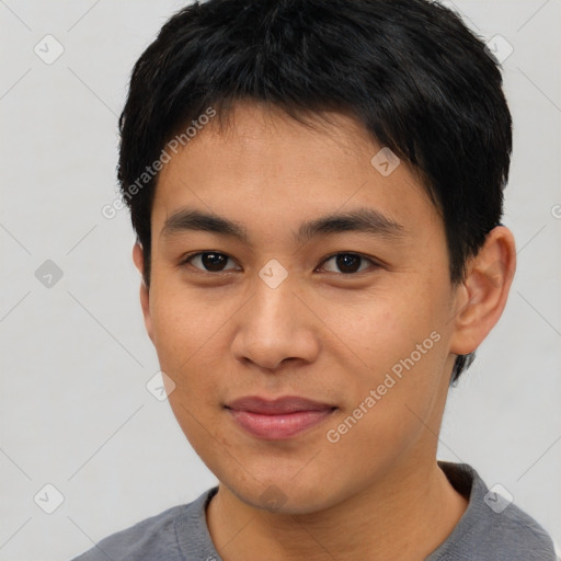 Joyful asian young-adult male with short  black hair and brown eyes