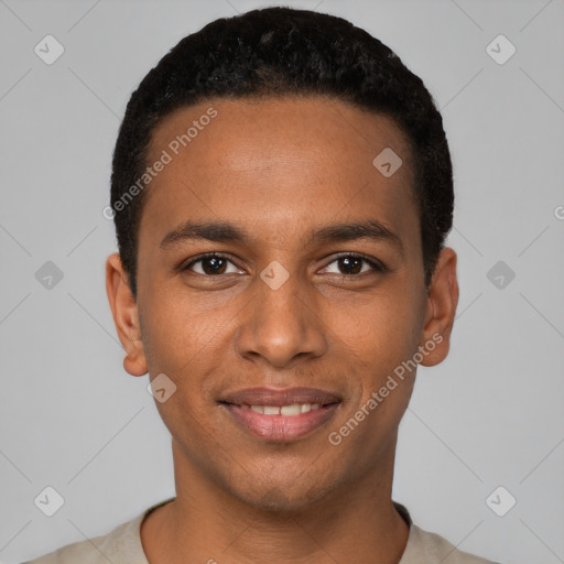 Joyful black young-adult male with short  black hair and brown eyes