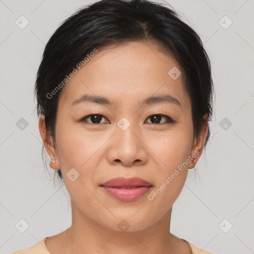 Joyful asian young-adult female with medium  brown hair and brown eyes