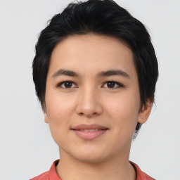 Joyful asian young-adult female with medium  black hair and brown eyes