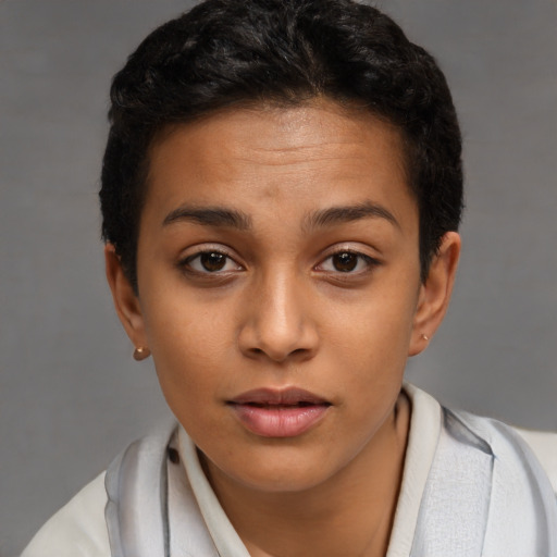 Joyful latino young-adult female with short  brown hair and brown eyes