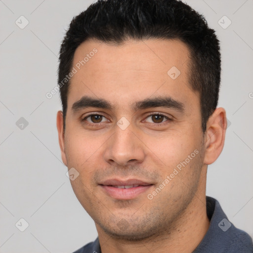 Joyful white young-adult male with short  black hair and brown eyes