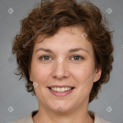 Joyful white adult female with medium  brown hair and green eyes