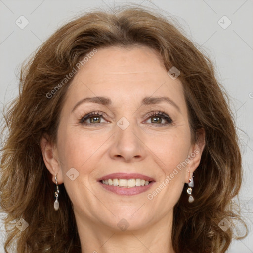 Joyful white adult female with long  brown hair and green eyes