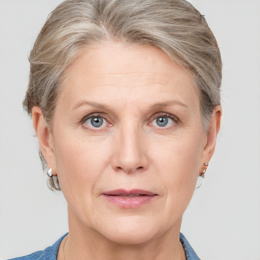 Joyful white adult female with short  brown hair and grey eyes