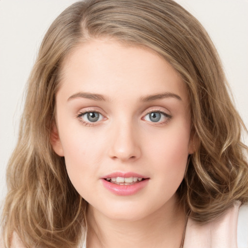 Joyful white young-adult female with long  brown hair and green eyes