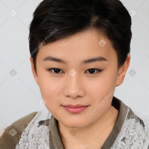 Joyful asian young-adult female with short  brown hair and brown eyes