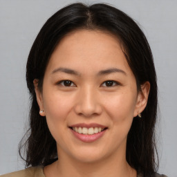 Joyful asian young-adult female with medium  brown hair and brown eyes