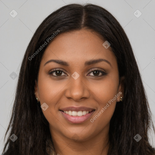 Joyful black young-adult female with long  brown hair and brown eyes