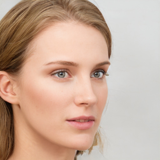 Neutral white young-adult female with long  brown hair and blue eyes