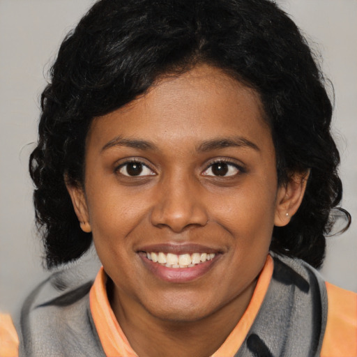 Joyful latino young-adult female with medium  black hair and brown eyes