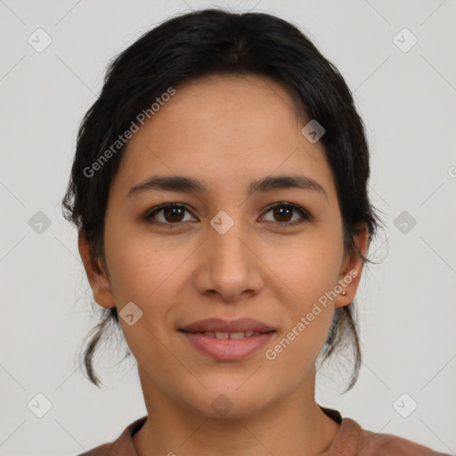 Joyful latino young-adult female with medium  brown hair and brown eyes