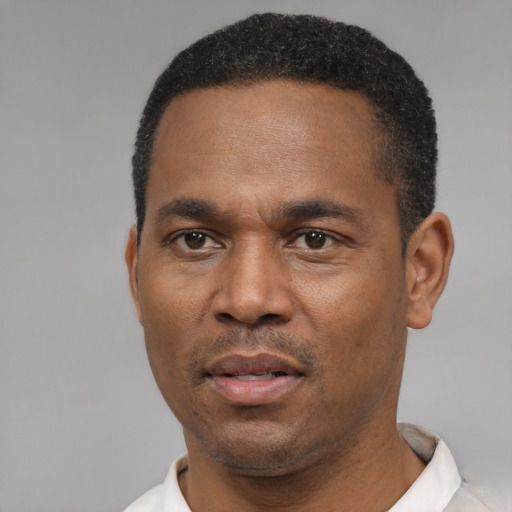 Neutral black adult male with short  black hair and brown eyes