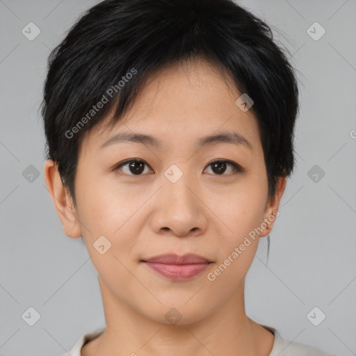 Joyful asian young-adult female with short  black hair and brown eyes