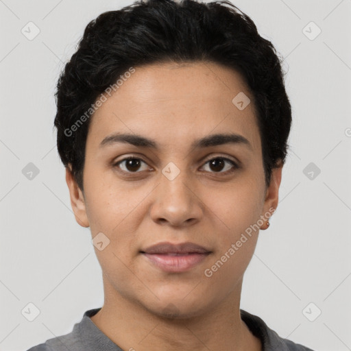 Joyful latino young-adult female with short  black hair and brown eyes