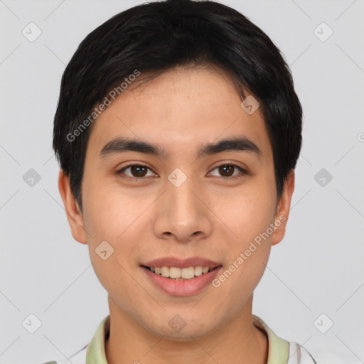 Joyful asian young-adult male with short  brown hair and brown eyes