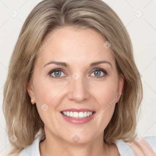 Joyful white young-adult female with medium  brown hair and blue eyes