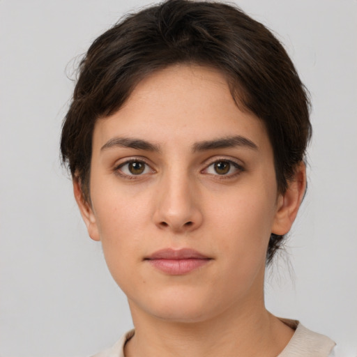 Neutral white young-adult female with short  brown hair and brown eyes