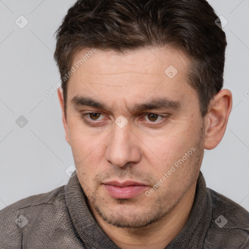 Neutral white adult male with short  brown hair and brown eyes