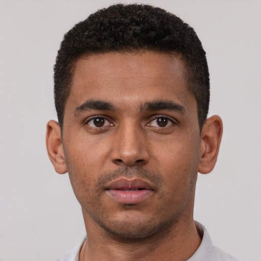Neutral black young-adult male with short  black hair and brown eyes