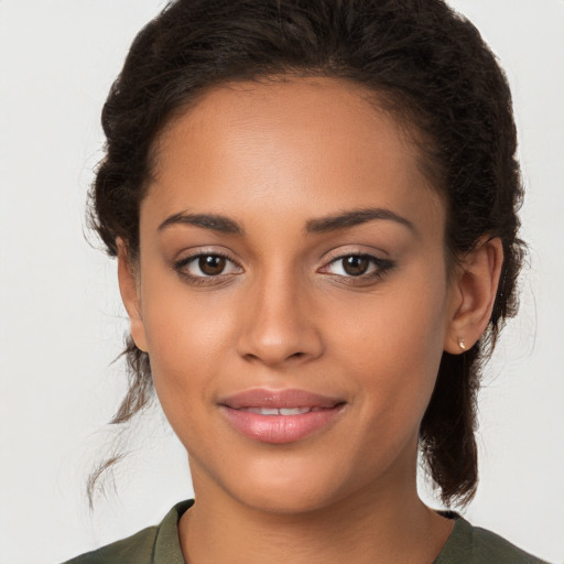 Joyful white young-adult female with long  brown hair and brown eyes