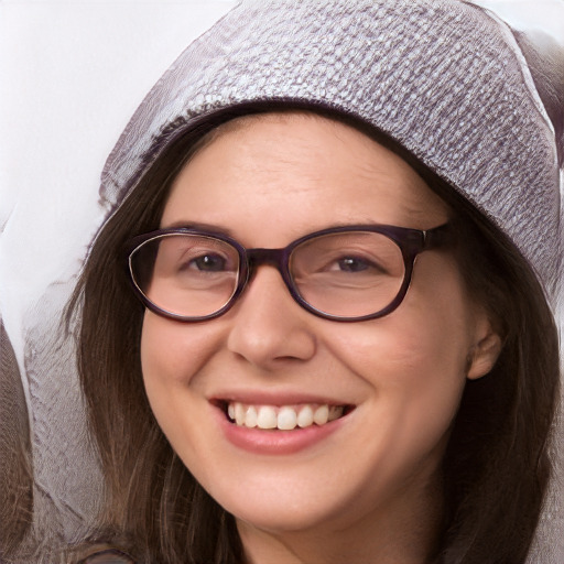 Joyful white young-adult female with long  brown hair and blue eyes