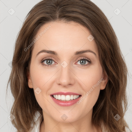 Joyful white young-adult female with long  brown hair and green eyes