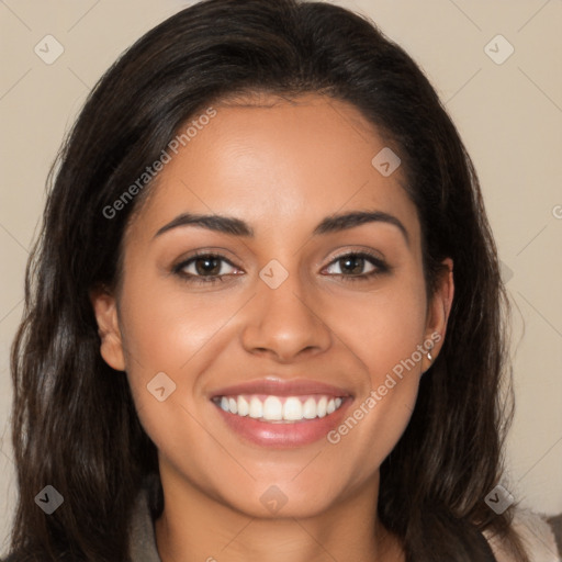 Joyful latino young-adult female with long  brown hair and brown eyes