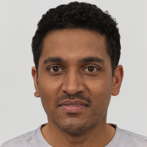 Neutral black young-adult male with short  black hair and brown eyes